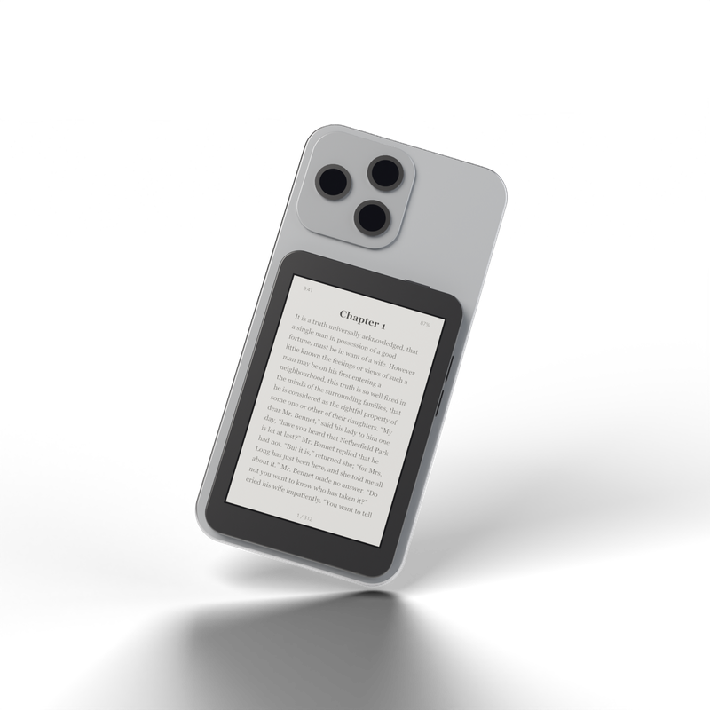 Xteink X3 magnetically attached to the back of a phone, showing an e-ink book page